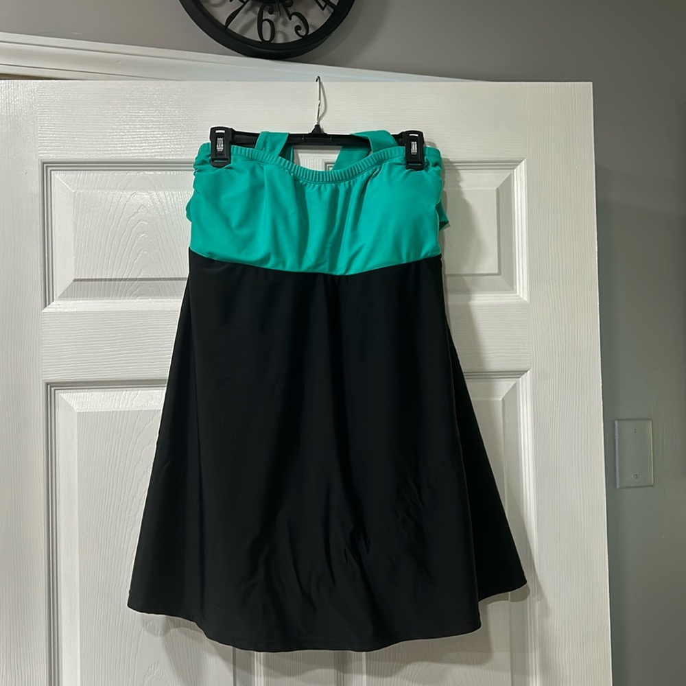 Women’s halter swim dress with built in shorts.